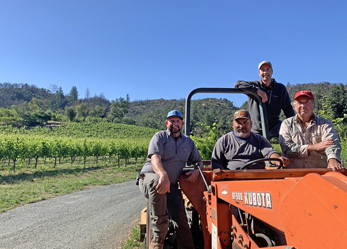 Vineyard management crew on tractor